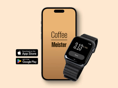 A smartphone and smartwatch on a light brown background displaying the 'Coffee Meister' app, with the phone screen showing the app name and the watch indicating a TDS reading of 3.13 %TDS. Icons for the Apple App Store and Google Play are placed on the left, highlighting the app's availability for both platforms, catering to the needs of baristas and coffee lovers.